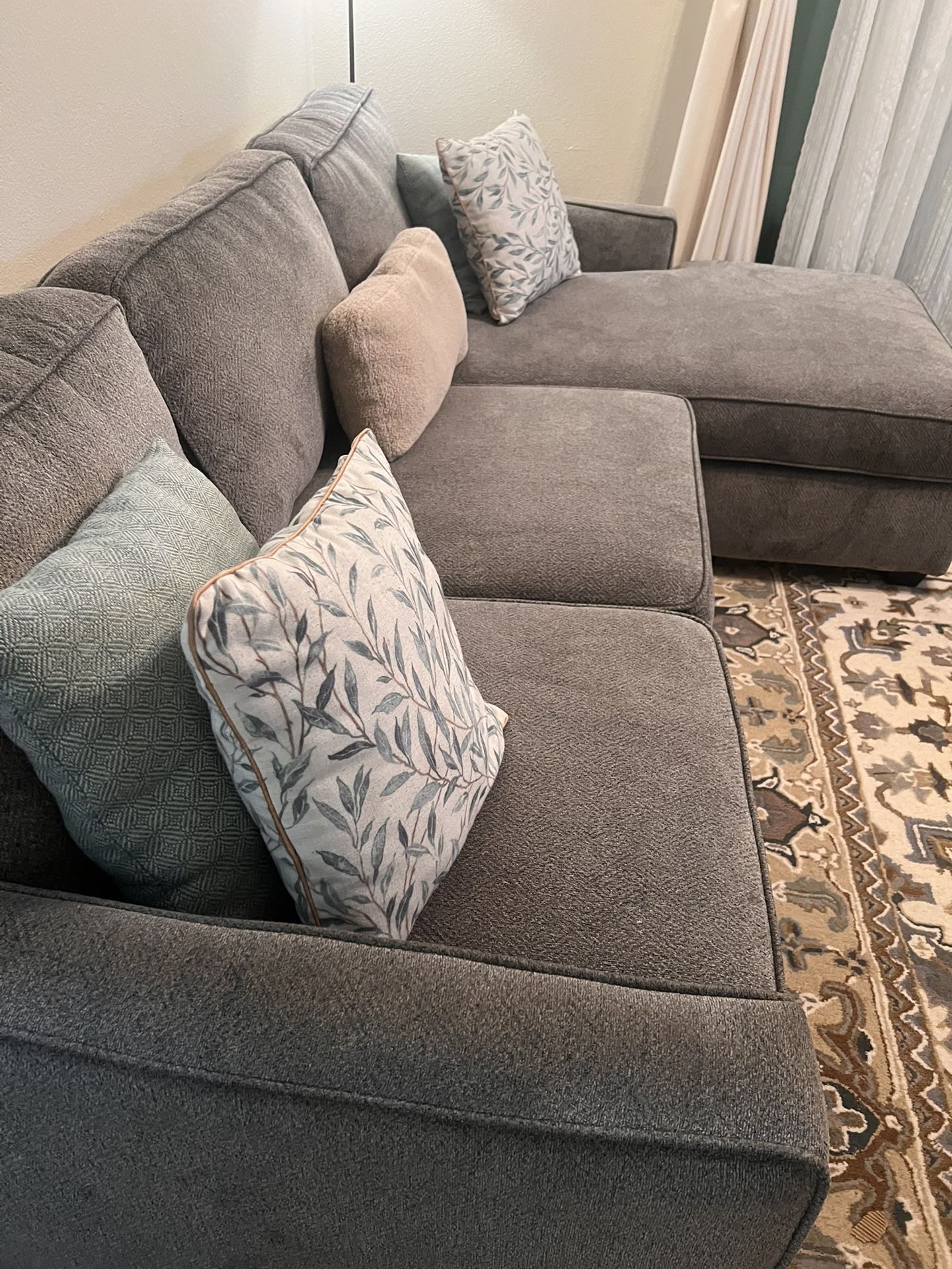 Grey Couches From Bobs Furniture comes with Extra Covers And Extra Cushion.