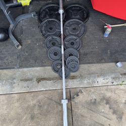 Olympic weights set 245lbs total plus 7ft 45lbs bar
