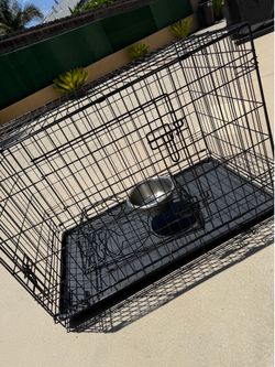 Dog kennel with bowls