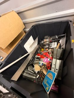 Storage tub, full of miscellaneous items, including a craftsman drill Storage tub full of miscellaneous items, including a craftsman drill