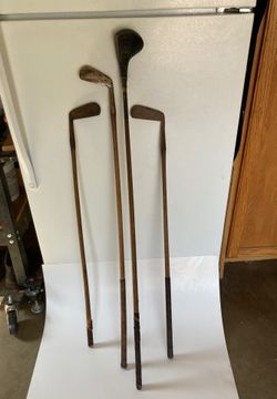 4 antique golf clubs
