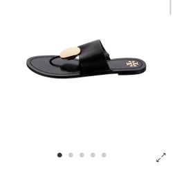 Authentic Tory Burch Patos Disk Thong Leather Sandals in black with gold-tone logo detail. Stylish, comfortable, and perfect for everyday wear or vaca
