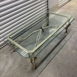 Iron base & glass coffee table- has a  tiny chip on under  the glass.  60 “ wide , 33” depth , 18 “
