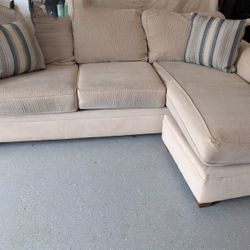 beige couch with ottoman