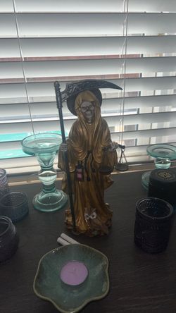 Golden Santa muerta statue
