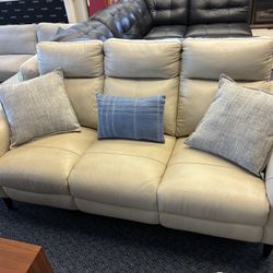 Beige leather electric reclining sofa