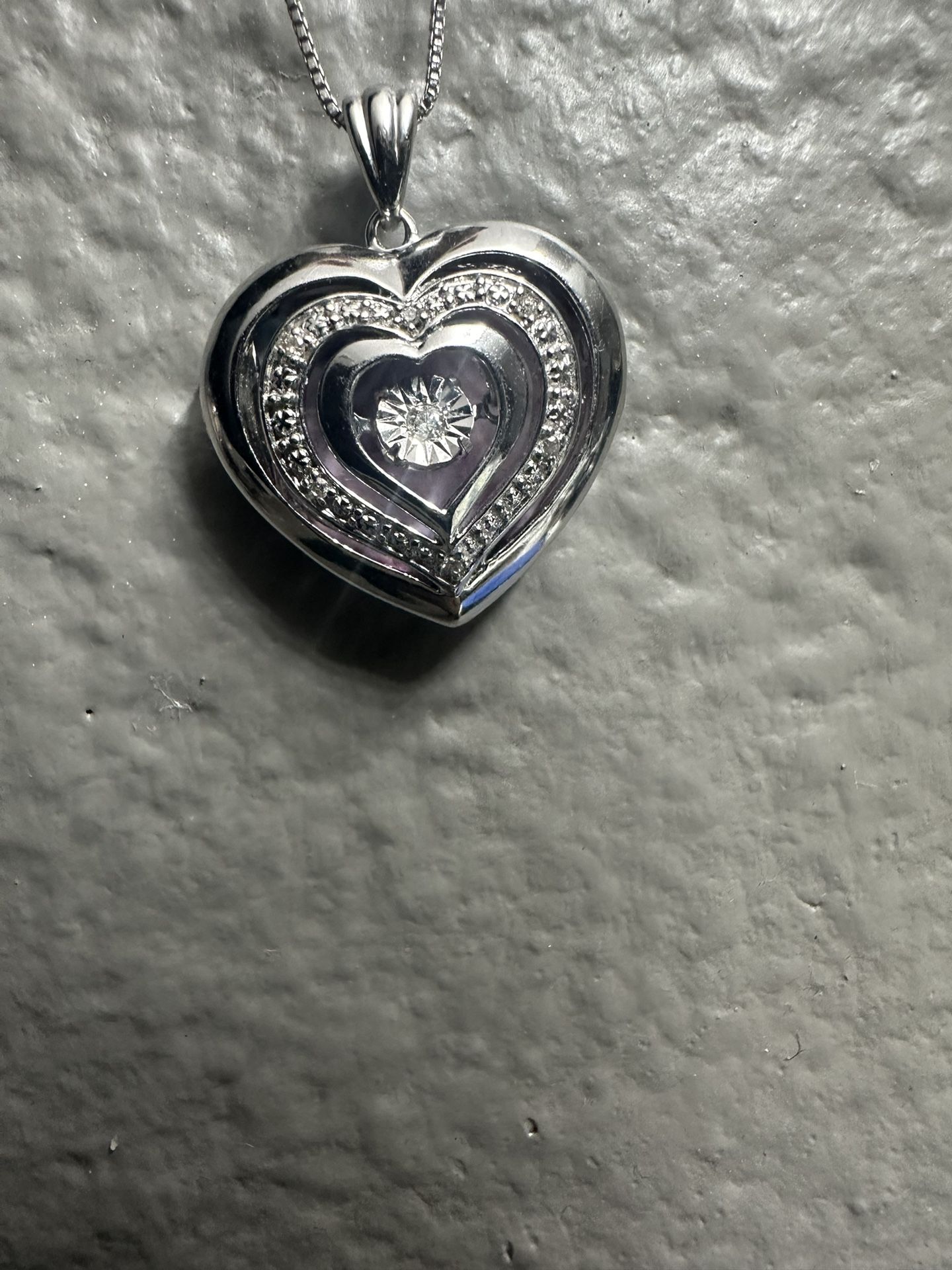 1/20 CT. T.W. Diamond Triple Heart Locket in Sterling Silver