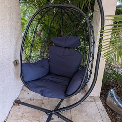 Hanging egg chair with stand and cushions