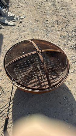 Large Fire pit with a spark guard and fire poker