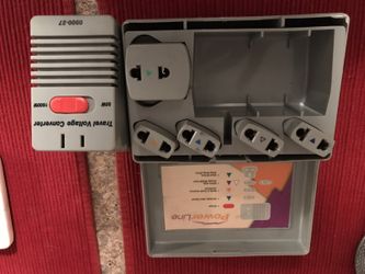 Travel voltage converter and adaptors