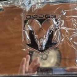 Dodge chrome metal tag with hardware.