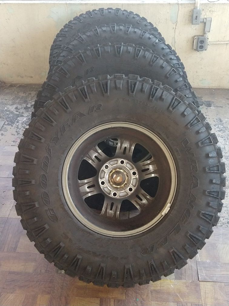 These are 4 like brand new goodyear Wrangler tires. They come with the the lugnuts and the spacers for this setup w/ rims. They are 285/ 75R 16.