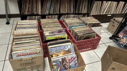Saturday April 18 Record sidewalk sale $1.00 records vhs CDs and cassettes