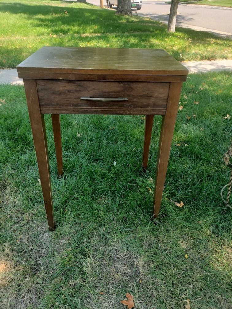 Free singer sewing machine or use as end table