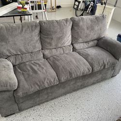Gray Couch And Swivel Lazy Rocking Chair
