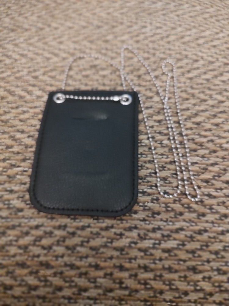 BADGE HOLDER.  NEW.  PICKUP ONLY.