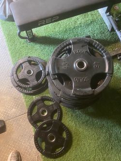 Commercial Olympic rubber weight plates multi grip 45 & 25lbs multiple pairs