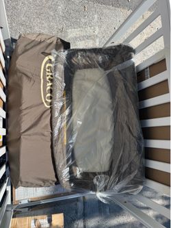 Portable crib with attachable changing table