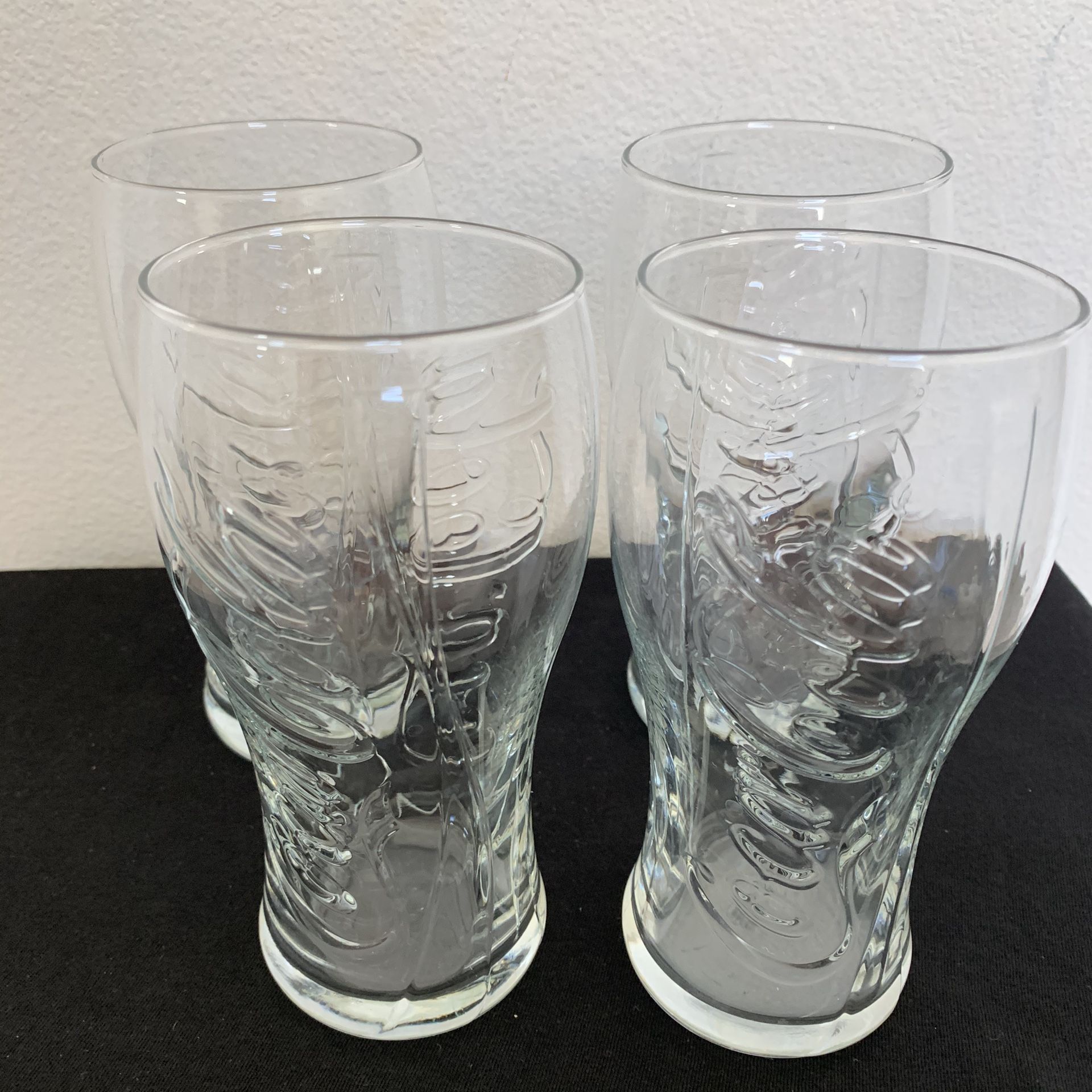 Lot of 4 Coca Cola glasses coke collectible raised logo