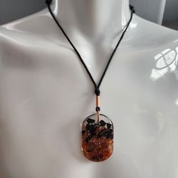 Aura Orgonite Pendant, Provides EMF Protection, and Positivity

Weighs 0.6 oz
Height 2 in.
Width 1.3 in.
Thick 1/4
Cotton Rope length  15.75 to 27.5  