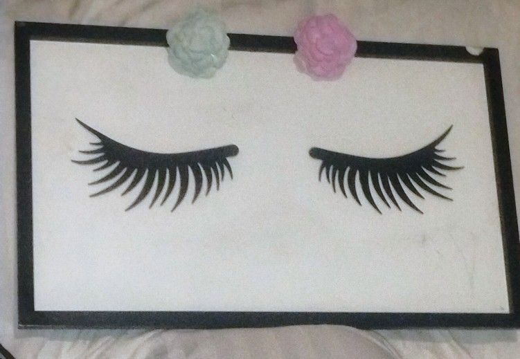 metal eyelashes with flowers on white backing