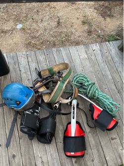 Arborist spikes, helmet, rope and belt