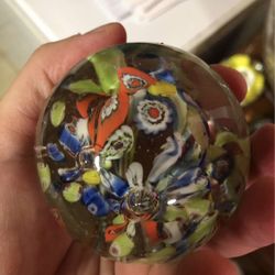 Vintage clear paperweight with colorful flowers inside