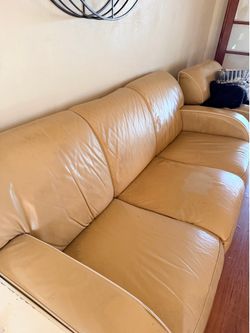 Living room set. Couch, chairs, end table, coffee table, and entertainment cabinet