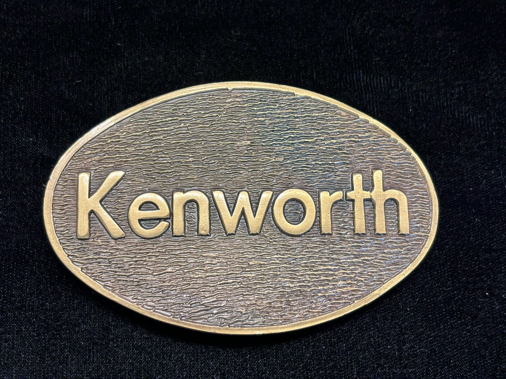 Vintage Kenworth Corporation Oval Solid Brass Belt Buckle #7502 NOS ASTMAR INC.