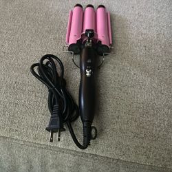 un enchinador de pelo 