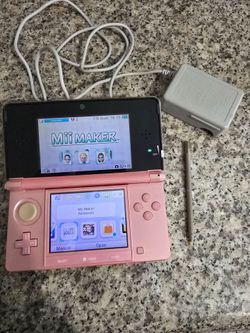 Pink Nintendo 3DS with charger and stylus