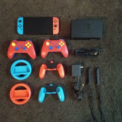 NINTENDO SWITCH OLED **Modded* with 512GB and 120 GAMES and Extra Controllers and Wheels 