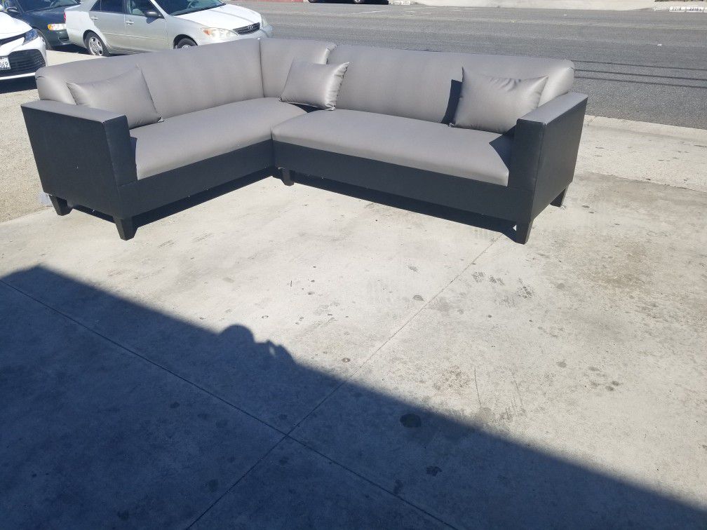 NEW 7X9FT GREY LEATHER COMBO SECTIONAL COUCHES