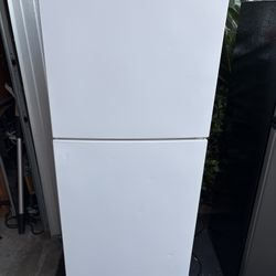 White Refrigerator 21 1/4”w by 22 1/4”d by 57 “h