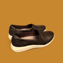 Clarks black leather slip-on loafers with a comfortable, cushioned footbed