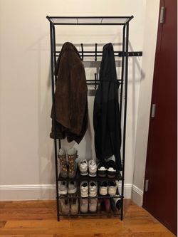 Black metal shoe and coat rack