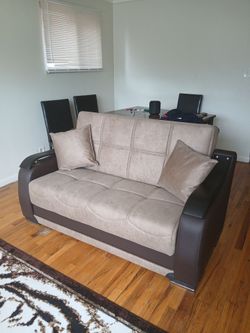 Convertible leather and suede love seat with storage compartment