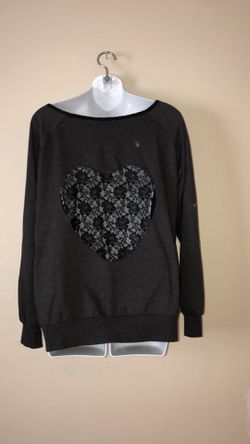 Size xl black sheer heart sweatshirt. It has a couple spots