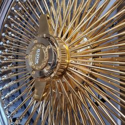 4 22INCH GOLD WIRE WHEELS WITH CHROME LIP AND GOLD KNOCK OFF CENTER CAPS WITH ALL HARDWARE $3300