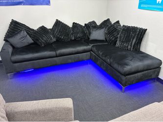 Brand new black sectional and dining room table set