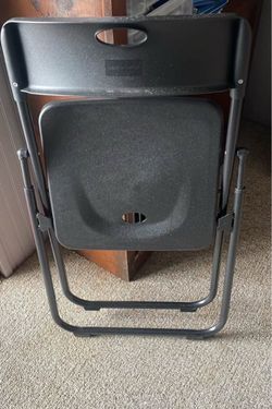 Black Plastic Folding Chair. Four available