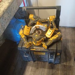 Complete DeWalt Tool Set That Comes With Grinder Two Batteries Pump Orbital Sander Circular Saw A Fine Cutting Tool Impact Gun And A Drill And A Charg
