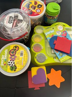 Perler beads craft…. Green sorting board, Star Wars beads with paper images, super Mario three paper with images, small bead jar and be set with four 