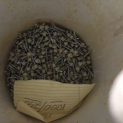 Tin Roof Screws With Rubbers On Them Beige There's A Long Ones There's A 1,250 Of Them