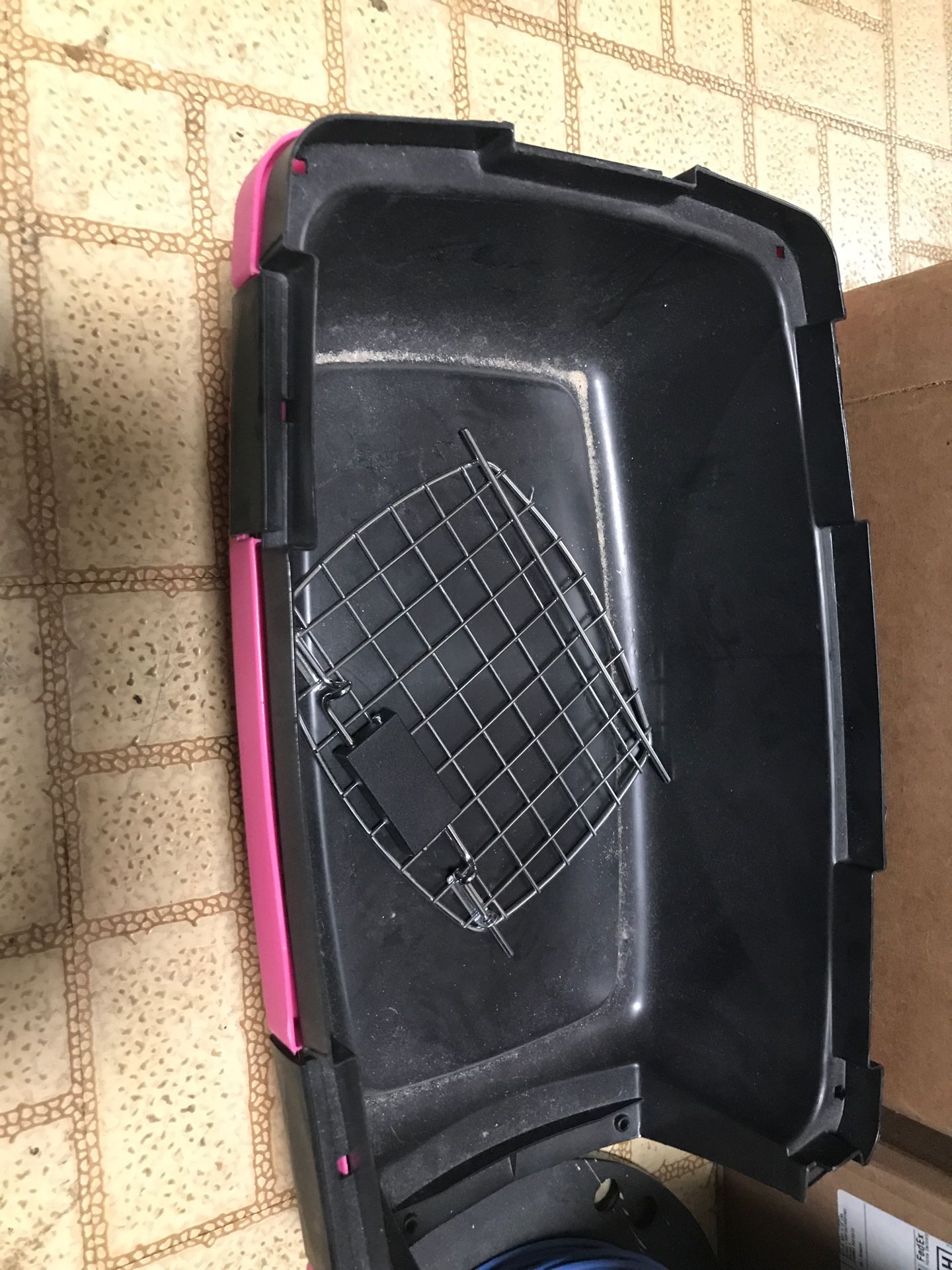 Small pink and black dog crate