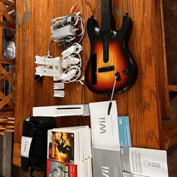 Nintendo Wii w/16 games, WiiFit Balance Board and Guitar. 200obo