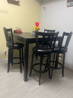High top table with four swivel chairs
