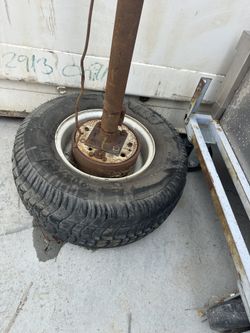 Trailer wheels and Axel  Size wheels 20.5x8 Sold as one  Tires hold air 4 lug wheels  Located in west Lancaster 