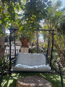 Outdoor Rocking bench chair with pillows for your yard