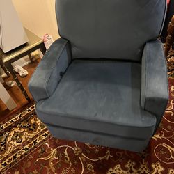 Blue spinning recliner chair